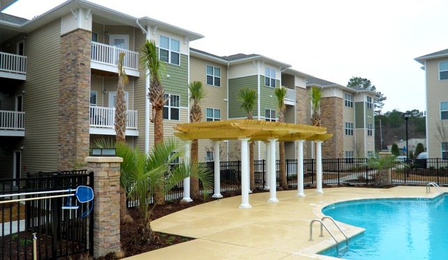 Relaxing poolside view at Brookside Crossings Apartments in Lake Columbia, SC.