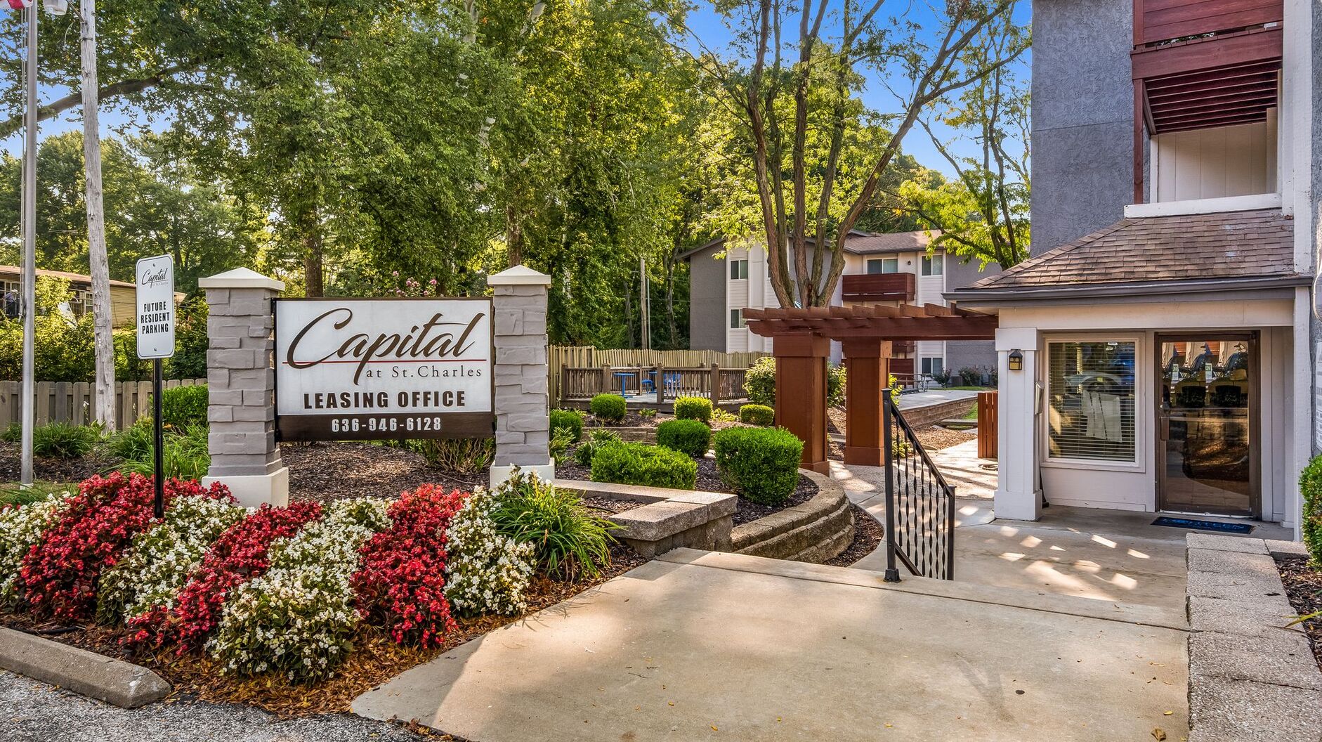 Capital at St Charles' sign in front of a building